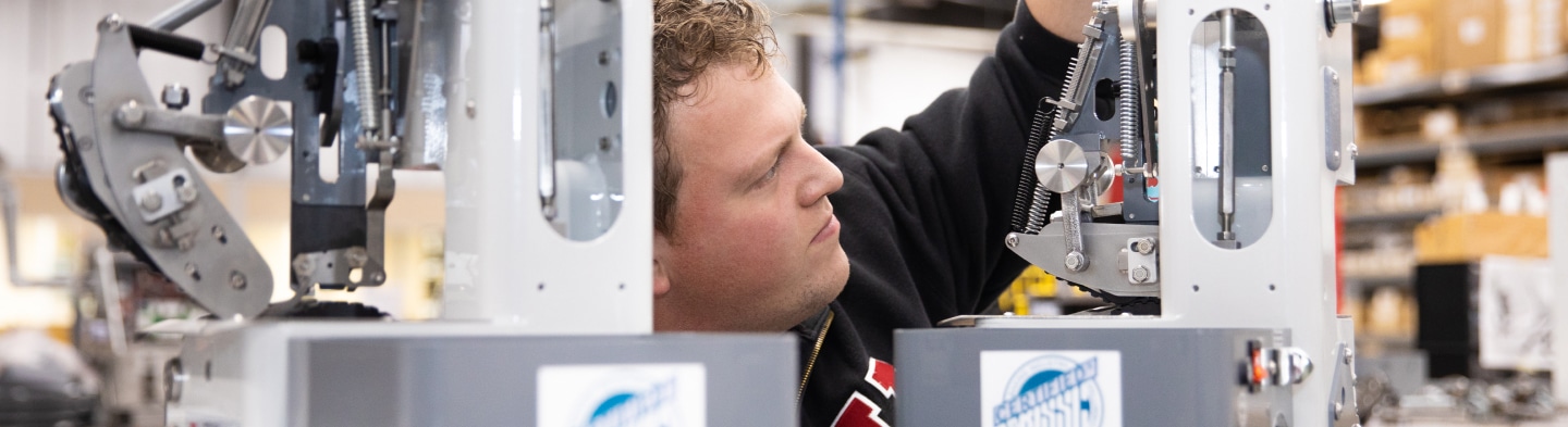 Governance - man working with closure machine